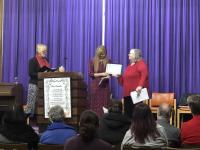 Minister Jacqui Wright presents Caroline Scott (President) and Mary Waterston (Treasurer) with the Church's Re-dedication Certificate